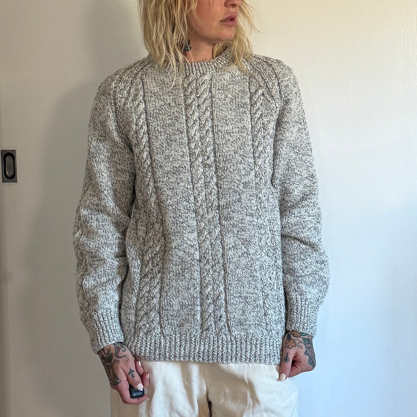 Vintage handmade knitted sweater in a light grey blue